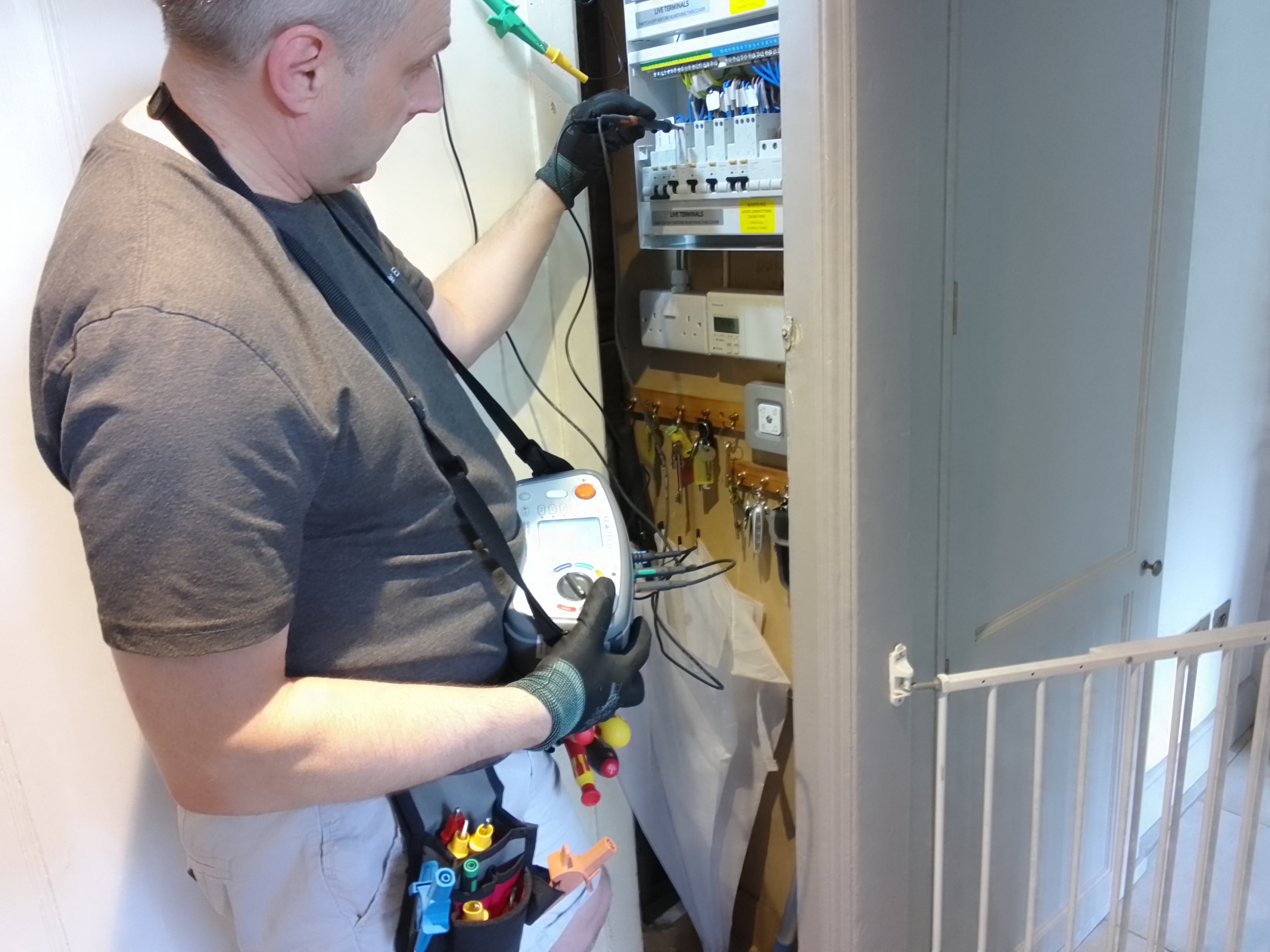 Electrical inspection and testing being carried out at a consumer unit